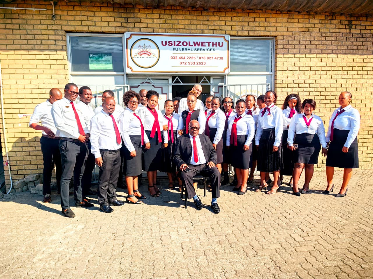 Usizolwethu Funeral Services staff outside a branch